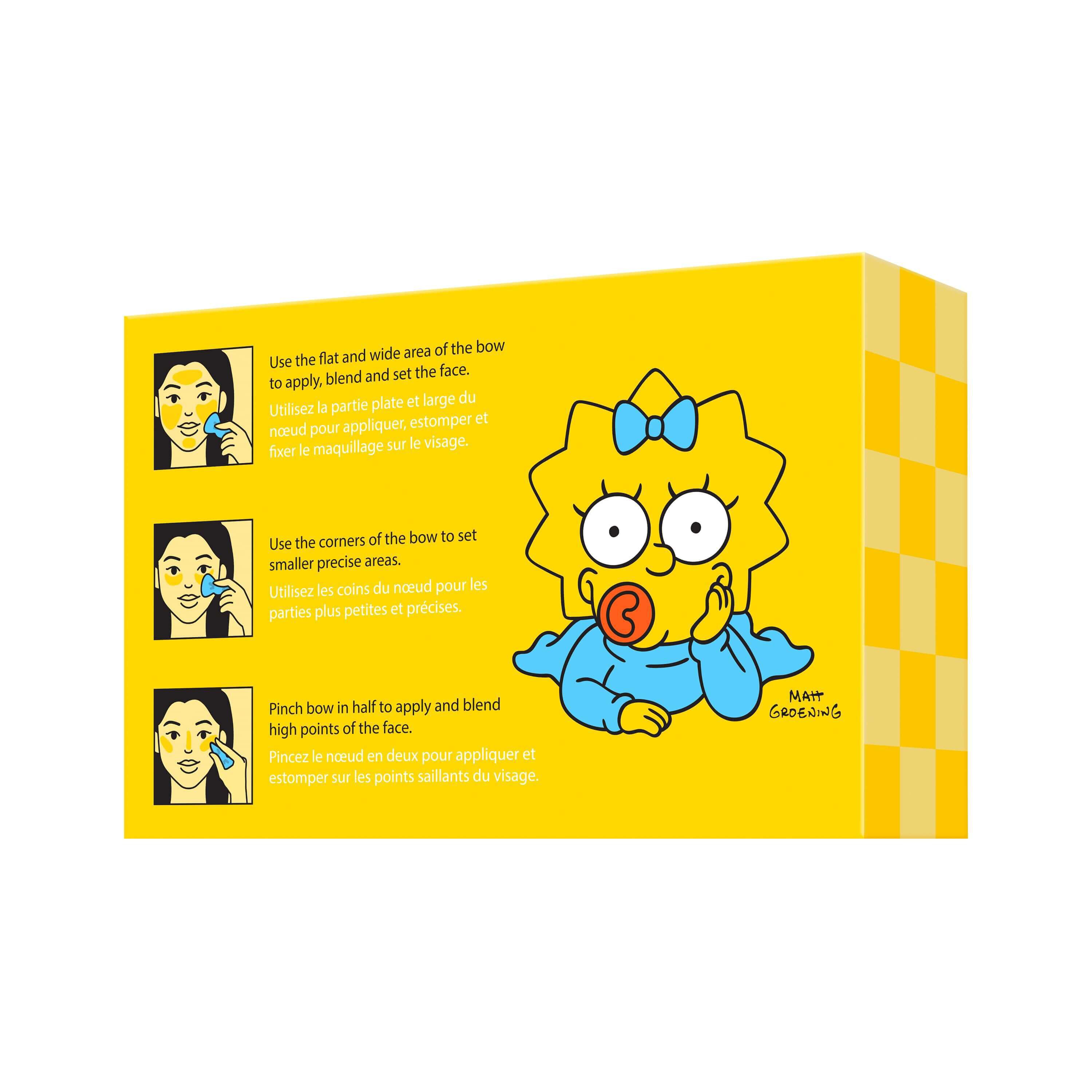 Immagine del retro della confezione della spugnetta trucco NYX Maggie Simpson Bow che mostra il packaging giallo con l'illustrazione del personaggio e le istruzioni.
