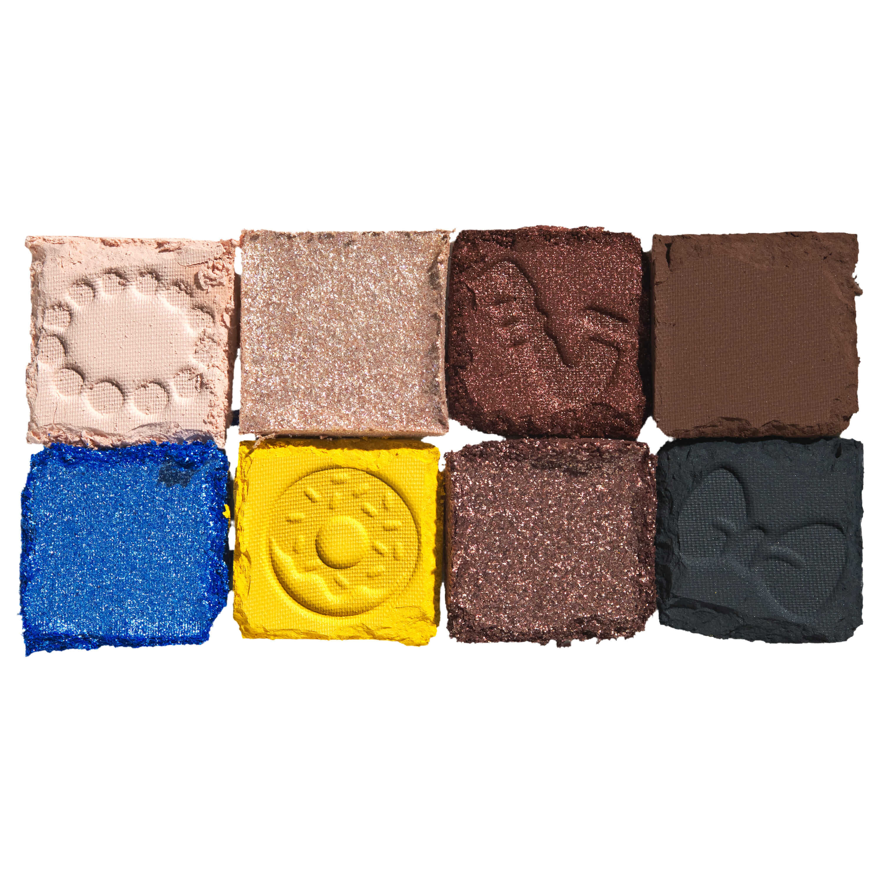 Swatch della palette di ombretti NYX The Simpsons Family Color Palette, vengono mostrate sei tonalita tra cui blu, giallo, marrone e nero.