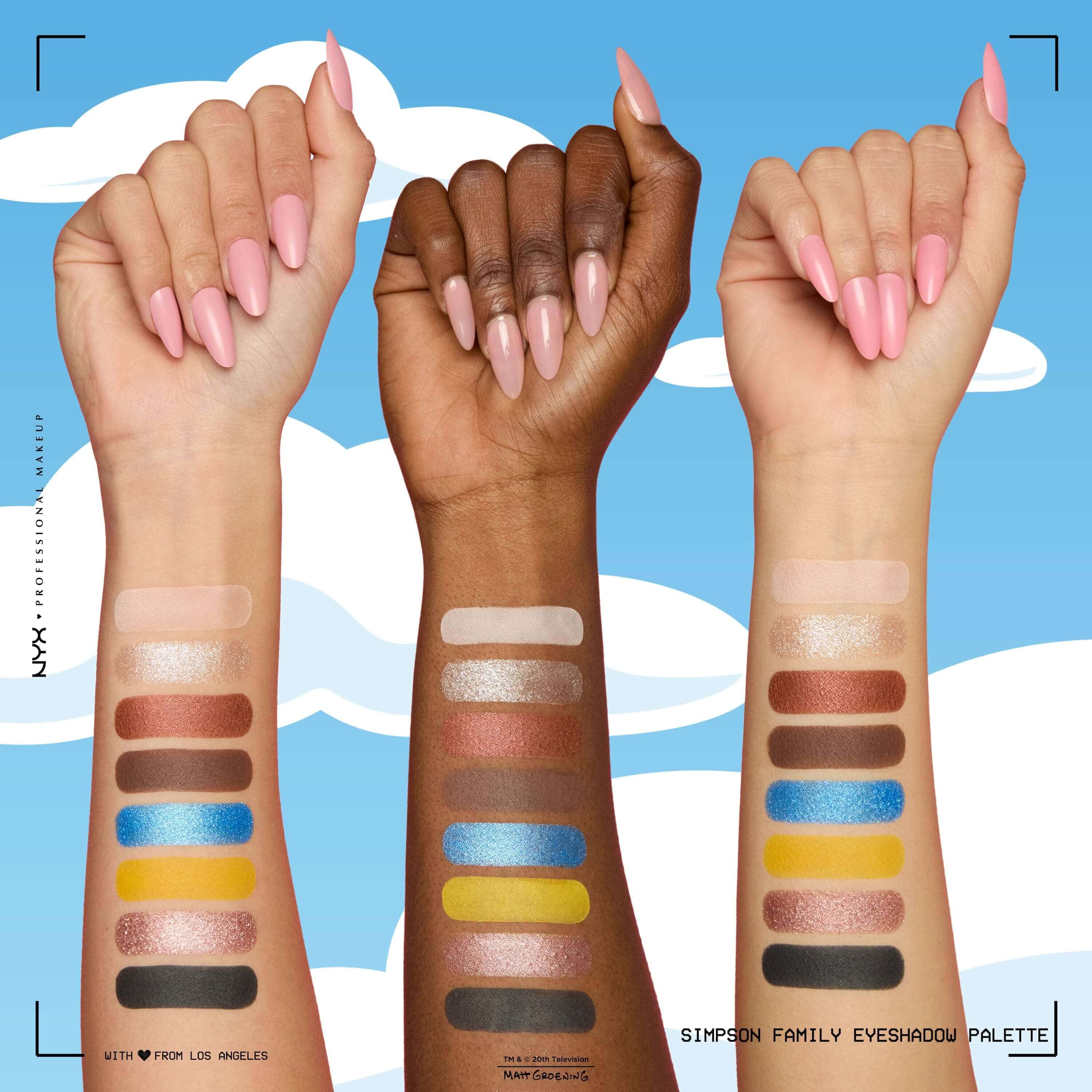Swatch sul braccio della palette di ombretti NYX The Simpsons Family Color Palette che mostra diverse tonalita applicate su tre braccia con carnagioni chiare, medie e scure.