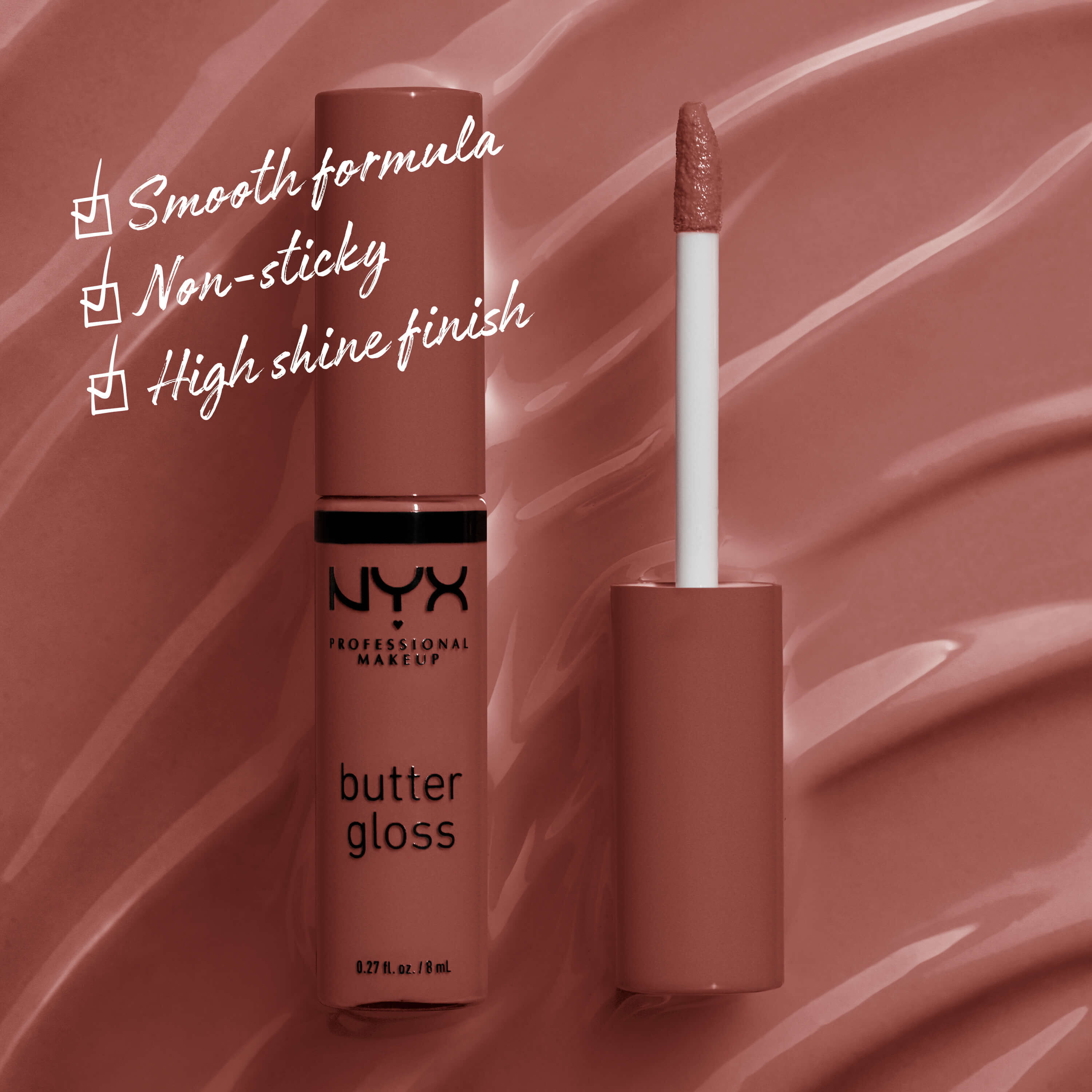 NYX Professional Makeup Butter Gloss nella tonalita 16 Praline mostrato aperto con formula scorrevole, sensazione non appiccicosa e finitura super lucida su uno sfondo marrone nude.