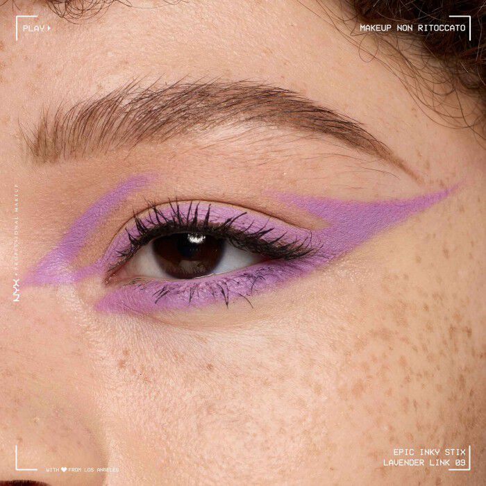 Close of a model wearing Epic Inky Stix on the top of their eyelid as a winged liner style in shade 08 Lavender Link