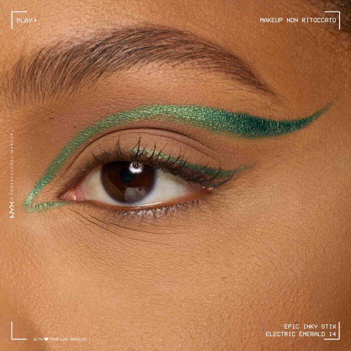 Close of a model wearing Epic Inky Stix on the top of their eyelid as a winged liner style in shade 14 Electric Emerald