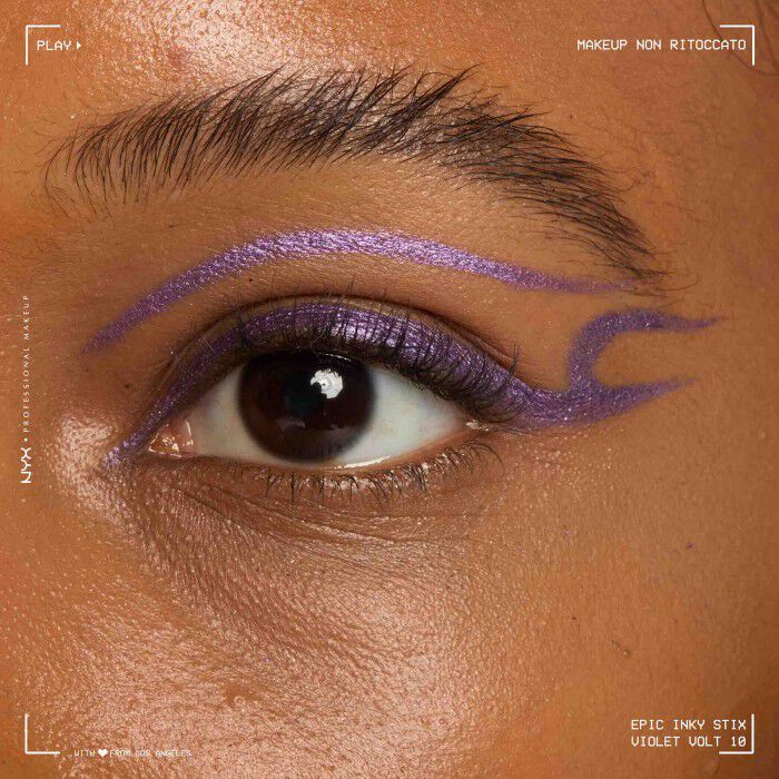 Close of a model wearing Epic Inky Stix on the top of their eyelid as a winged liner style in shade 09 Violet Volt