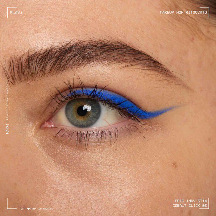 Close of a model wearing Epic Inky Stix on the top of their eyelid as a winged liner style in shade 05 Cobalt Click