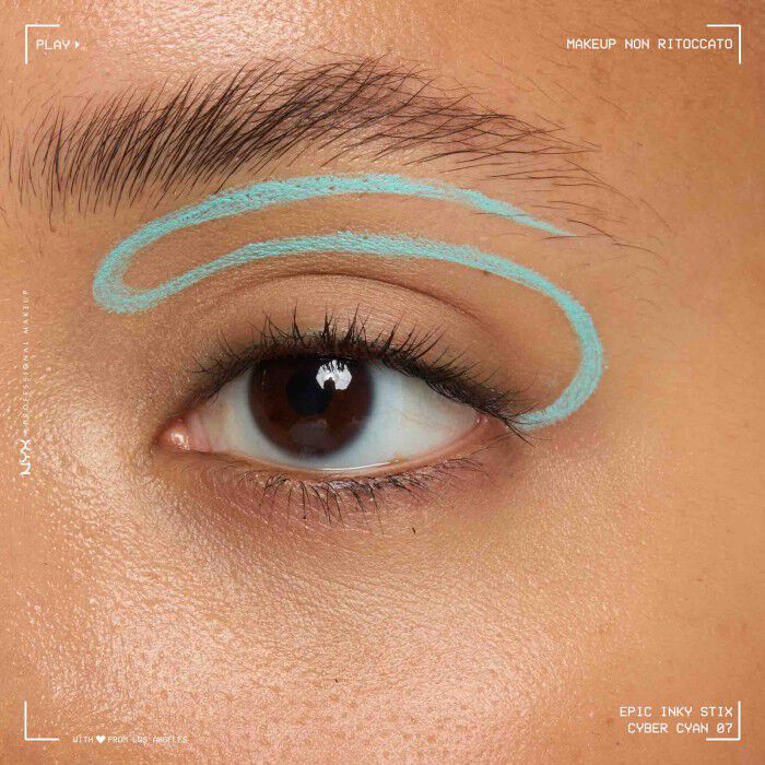 Close of a model wearing Epic Inky Stix on the top of their eyelid as a winged liner style in shade 06 Cyber Cyan