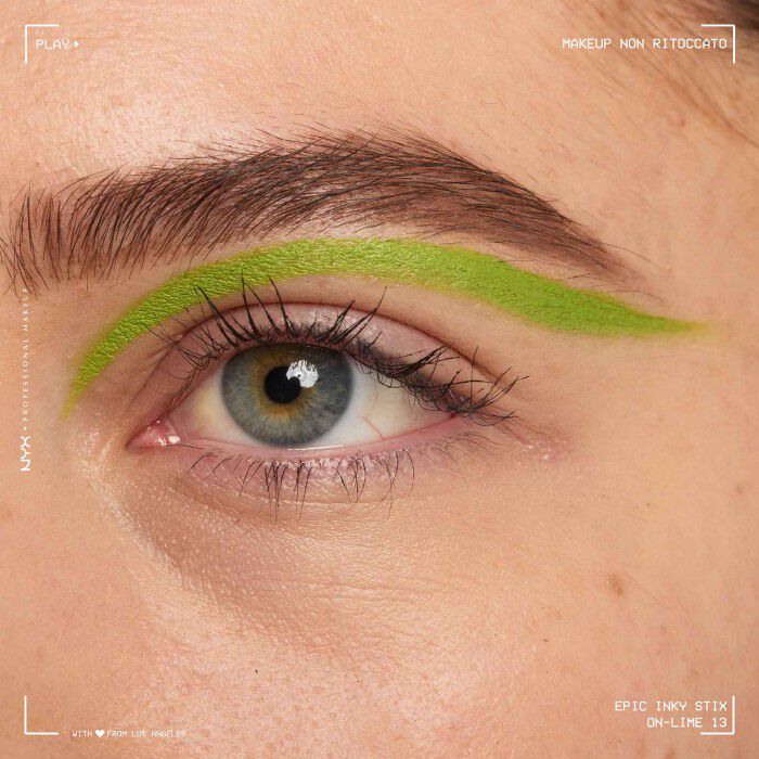 Close of a model wearing Epic Inky Stix on the top of their eyelid as a winged liner style in shade 13 On-Lime