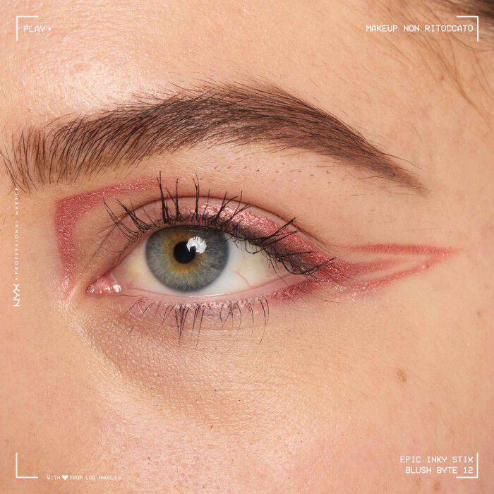 Close of a model wearing Epic Inky Stix on the top of their eyelid as a winged liner style in shade 12 Blush Byte