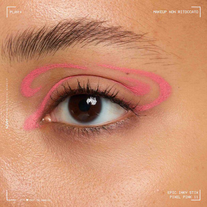 Close of a model wearing Epic Inky Stix on the top of their eyelid as a winged liner style in shade 11 Pixel Pink